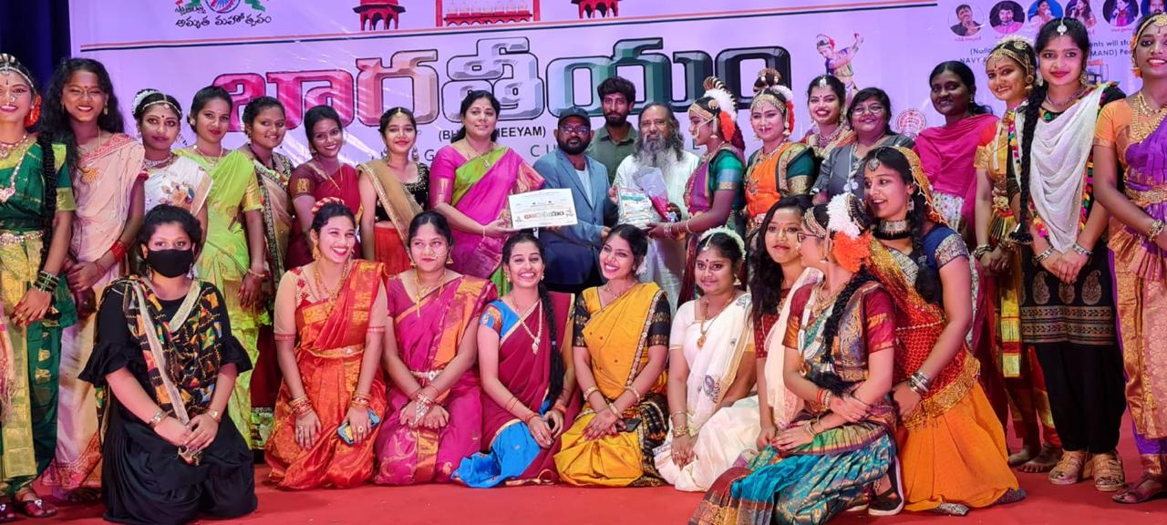 Dance troupe and organizers posing after a performance